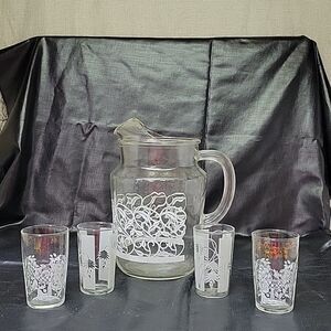 Assortment of 4 small glasses and a pitcher